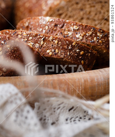 Slices of fresh wholemeal bread with baked crust and various cereals. Slices of fresh wholemeal bread with baked crust and various cereals. 93861524