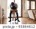 African Father playing with his boy 93864612