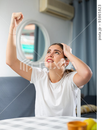Stressed young woman suffering from noisy neighbors Stressed young woman suffering from noisy neighbors 93865823
