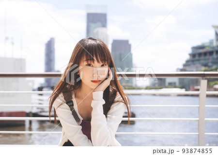 Portrait of young adult asian student woman face and long hair. 93874855