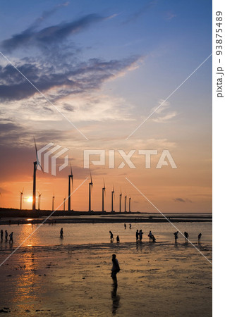 sunset view of Gaomei wetlands landscape and the wind power plant in Taichung, Taiwan. energy systems and renewable energy. 93875489