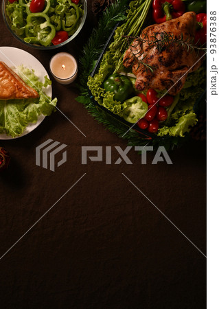 Thanksgiving dinner background with roasted turkey or chicken and all sides dishes. Thanksgiving celebration traditional dinner concept 93876388