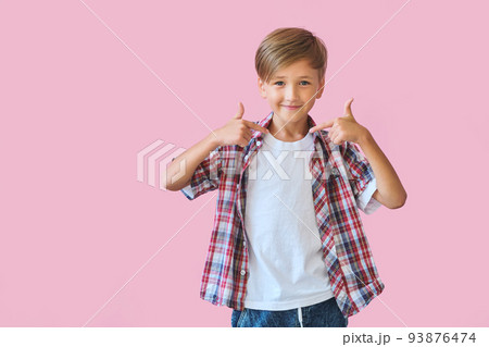 Young happy teen boy with in casuals on pink background. 93876474