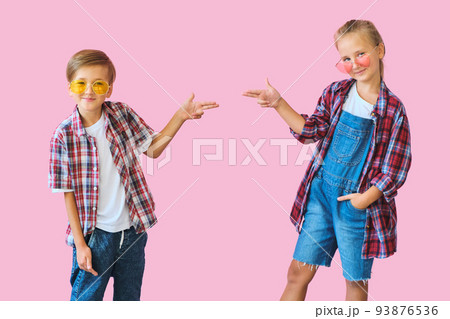 Cute stylish kids in color sunglasses looking at camera a 93876536