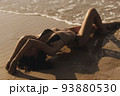 Sexy bikini beach vacation woman laying on the beach in freedom feeling, enjoying her summer vacation 93880530
