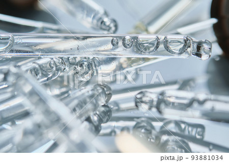 There are a lot of pipettes from cosmetics in one photo. 93881034