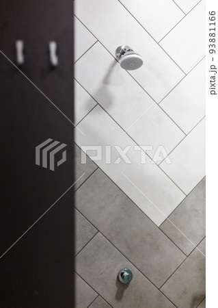 Stylish minimalist shower head built into wall in modern bathroom. 93881166