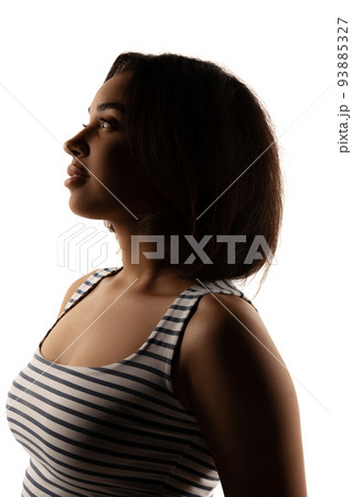 Silhouette portrait of young girl isolated over light background. Concept of beauty, creativity, shadow effect. Profile view 93885327