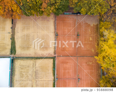 Aerial tennis courts in city park, yellow autumn 93888098
