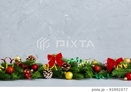 New Year Christmas tree toy, branches of a christmas tree, New Year decorations on a colored background New Year Christmas tree toy, branches of a christmas tree, New Year decorations on a colored background 93892077