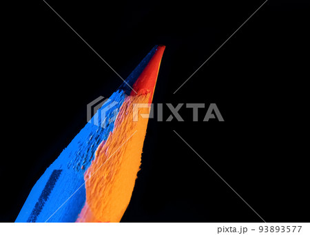Multi color lead pencil on black background. Illuminated with blue and yellow color light 93893577