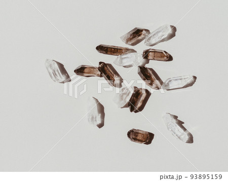 Light and grey crystals set on grey background 93895159