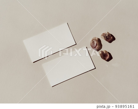 Light and grey crystals set and two white business cards branding mockup template on grey background. 93895161
