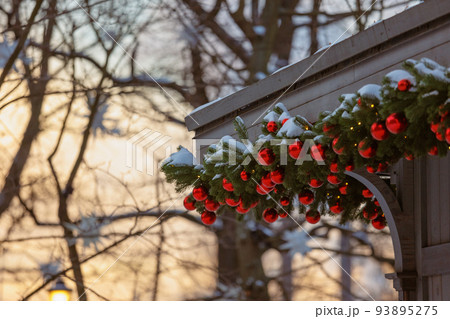 Decorating houses and streets for Christmas with Christmas tree toys and red snow white is looking for shiny balls. Decorating houses and streets for Christmas with Christmas tree toys and red snow white is looking for shiny balls. 93895275