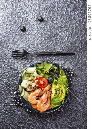 salad with avocado and shrimps in bowl, selective focus 93895762