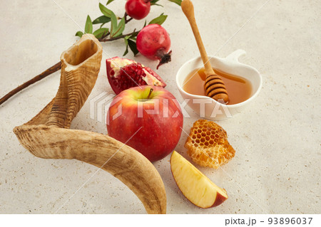 Rosh hashanah, jewish New Year holiday concept. Pomegranate, apples and honey traditional products for celebration Rosh hashanah, jewish New Year holiday concept. Pomegranate, apples and honey traditional products for celebration 93896037