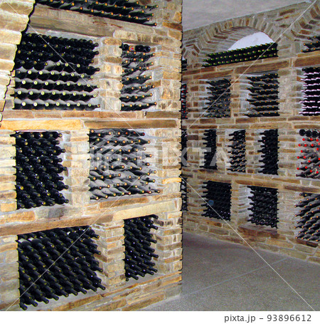 Gerakini, Greece- may 29, 2007: Wine cellars with old aged wine, bottles of wine from different years covered with dust and cobwebs Gerakini, Greece- may 29, 2007: Wine cellars with old aged wine, bottles of wine from different years covered with dust and cobwebs 93896612