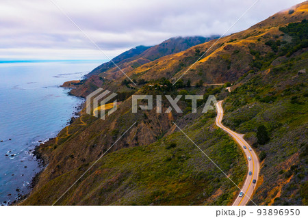 Aerial view of the Pacific Coast Highway going along the coastline of California Aerial view of the Pacific Coast Highway going along the coastline of California 93896950