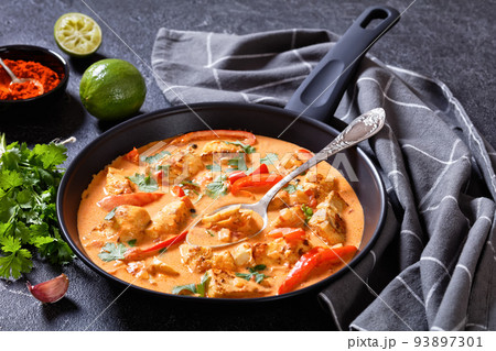 Fish Stew cooked with coconut milk and veggies Fish Stew cooked with coconut milk and veggies 93897301