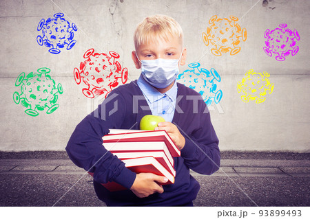 Young boy with protection mask against corona virus at school. 93899493