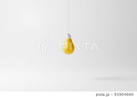 Hanging light bulb yellow standing on white background 93904660