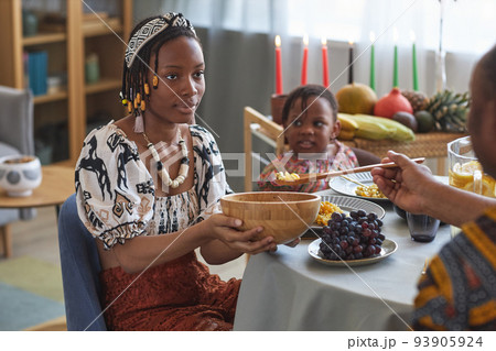 Family eating traditional food at dining table 93905924
