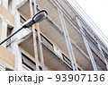 Old street lamp over the old building 93907136