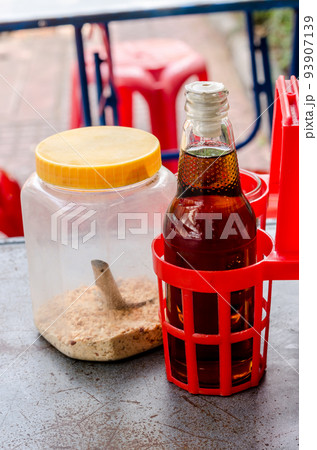 Fish sauce in plastic cap, ingredients of thai street food 93907139