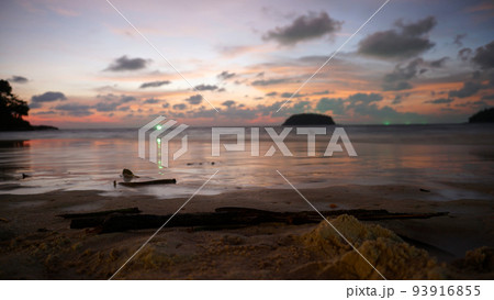 An epic sunset with a view of the sea and island 93916855