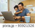 African American boy being naughty his dad 93921326