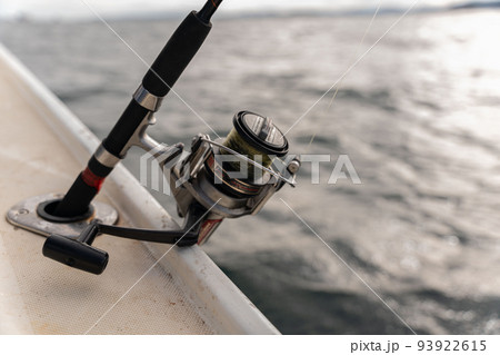Deep Sea Fishing Reel on a boat during sunrise Deep Sea Fishing Reel on a boat during sunrise 93922615