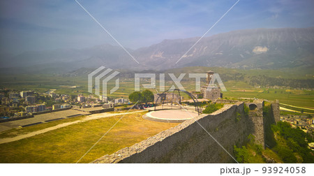 Panoramic view to Gjirokastra castle with the wall, tower and Clock, Gjirokaster, Albania Panoramic view to Gjirokastra castle with the wall, tower and Clock, Gjirokaster, Albania 93924058
