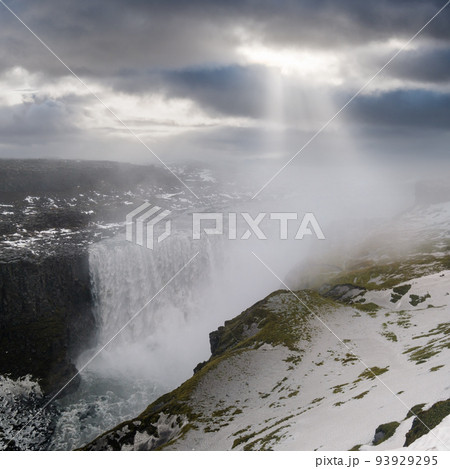 Picturesque full of water big waterfall Dettifoss autumn dull day view with sun rays through clouds, north Iceland. Picturesque full of water big waterfall Dettifoss autumn dull day view with sun rays through clouds, north Iceland. 93929295