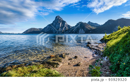 Peaceful autumn Alps mountain lake. Morning panoramic view to Traunsee lake and Traunstein mountain in far, Upper Austria. 93929320