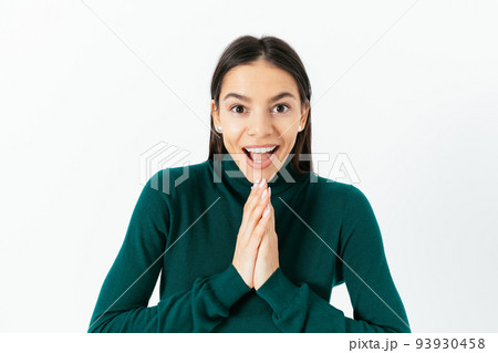 Portrait of young woman clasped her hands 93930458