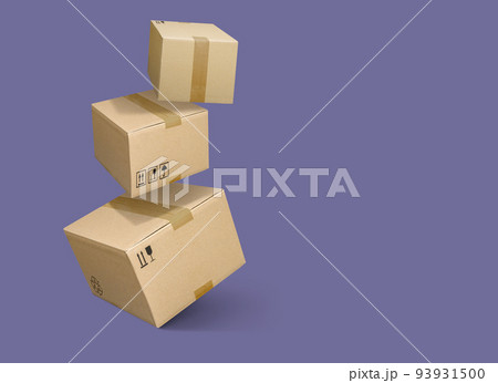 Cardboard parcel boxes falling on violet purple background Cardboard parcel boxes falling on violet purple background 93931500