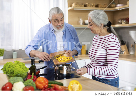 Healthy Eating For Seniors. Portrait Of Elderly Spouses Cooking Together In Kitchen Healthy Eating For Seniors. Portrait Of Elderly Spouses Cooking Together In Kitchen 93933842