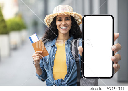Happy lady tourist showing nice mobile app for travellers 93934541