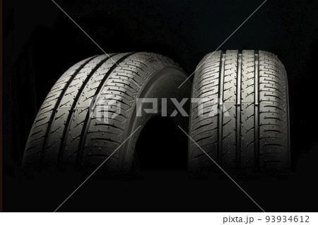 Two new summer wheels on a black tire background 93934612