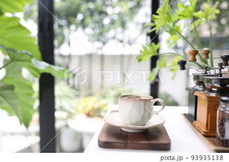 Unique coffee cup and coffee utensil on white table indoor Unique coffee cup and coffee utensil on white table indoor 93935138