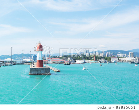 Marine lighthouse in clear weather. Turquoise sea 93935651