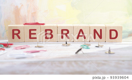 Rebrand and brand symbol. The concept word Rebrand on wooden cubes. Business rebrand and brand concept 93939604