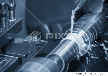 The lathe machine cutting the metal shaft parts with coolant method. The lathe machine cutting the metal shaft parts with coolant method. 93939775
