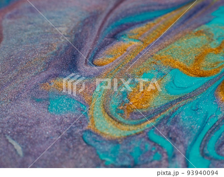 Glitter art. Abstract design. Colorful paint background. Cyan blue purple gold colors blend. 93940094