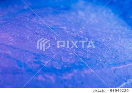 Blue paints on melting ice. Flowing liquid inks. Nature glacier. Creative art process 93940220