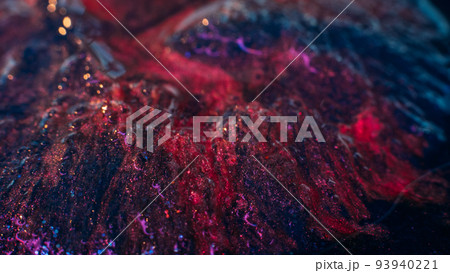 Multicolor textured glitter background. Glistening mixed paint. Red and dark blue inks blend. Multicolor textured glitter background. Glistening mixed paint. Red and dark blue inks blend. 93940221