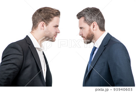 two businessmen starring to each other in business conflict, opposition 93940603
