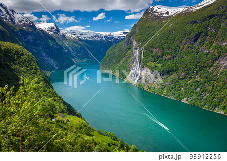 Ferry ship crossing Geirangerfjord and Seven Sisters Waterfalls, Norway Ferry ship crossing Geirangerfjord and Seven Sisters Waterfalls, Norway 93942256