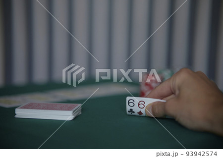 the poker game in casino chips cards and the poker table, winning combination in poker, flush royal 93942574