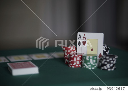 the poker game in casino chips cards and the poker table, winning combination in poker, flush royal 93942617
